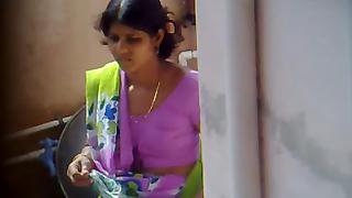 Indian wife at home washing stuff