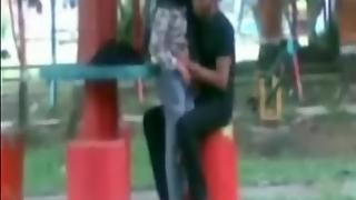 Desi couple in park kissing