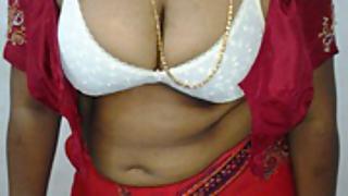 Mature Indian housewife taking her Indian outfits off in bedroom